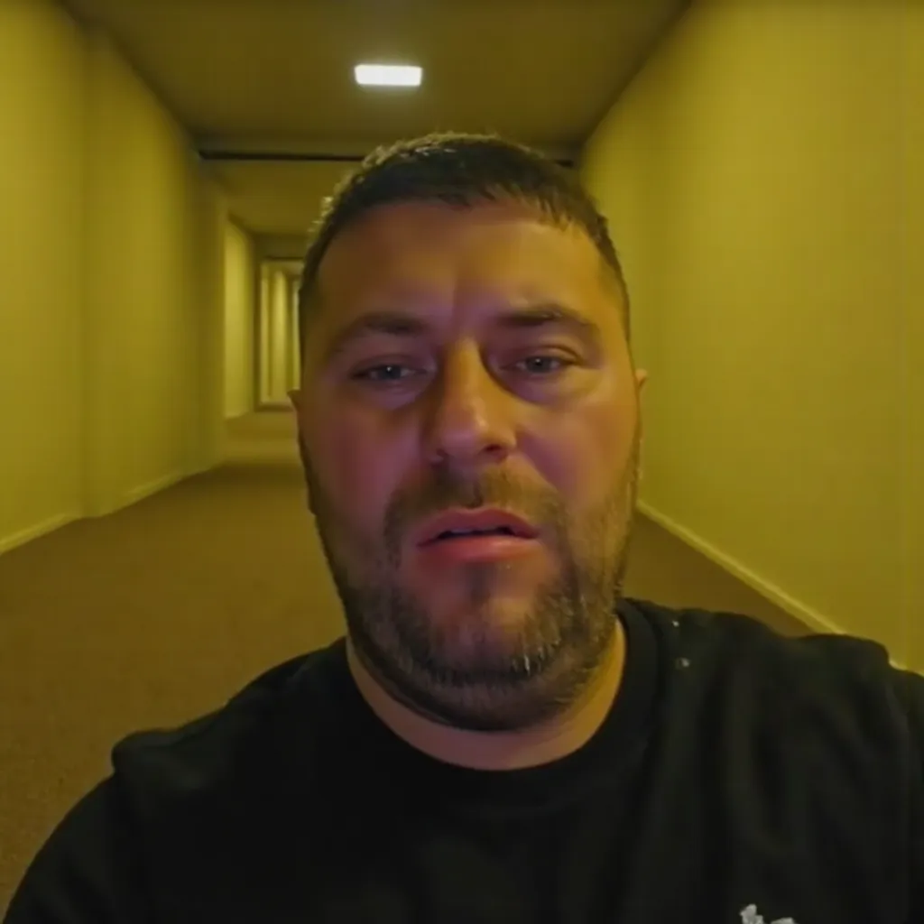 A man named Maroi selfie in the backrooms, empty, yellow lights, no windows, without windows, maze, weird, carpet, eerie